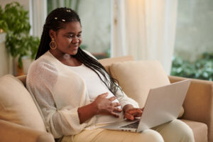 Pregnant woman having telemedicine session with her doctor